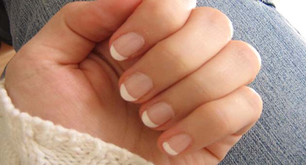 Image of girl showing her healthy nails