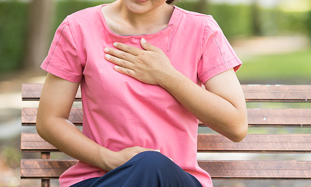 Image of girl suffering from acidity