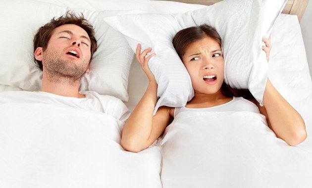 Image of an irritated woman who wants her partner to stop snoring