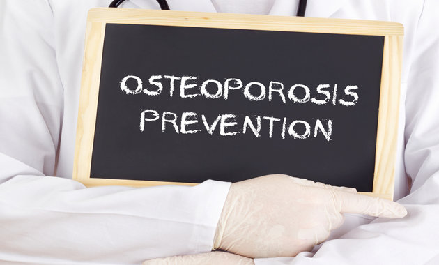 Image of a Doctor holding a board with message to prevent osteoporosis