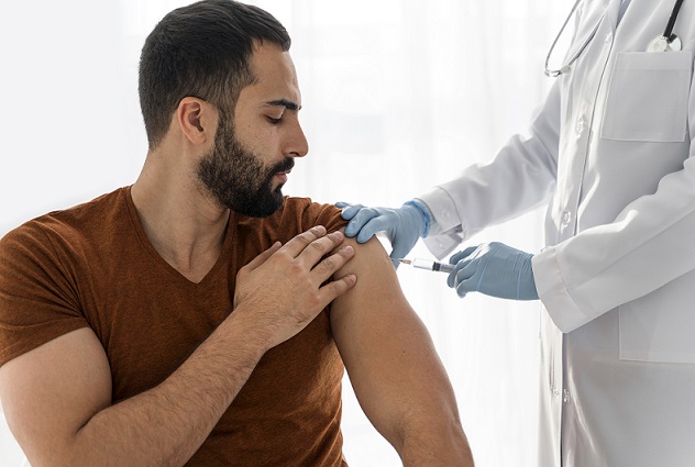 man-being-vaccinating-by-doctor