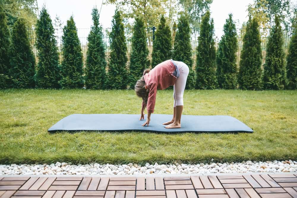 Little,Girl,5-6,Years,Old,Standing,In,The,Uttanasana,Position