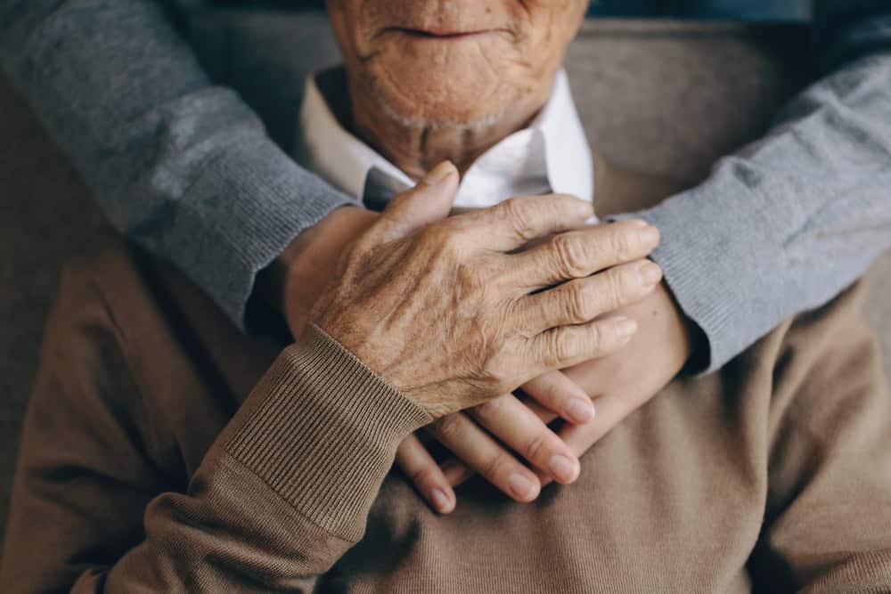 Happy,Healthcare,Worker,Hugging,A,Senior,Man,At,Home,And