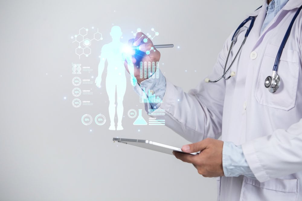 Doctor,Using,Tablet,Computer,With,Medical,Hologram,Over,White,Background.