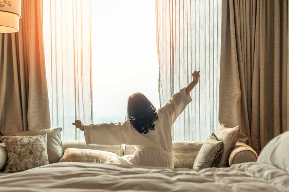 Hotel,Relaxation,On,Lazy,Day,With,Asian,Woman,Waking,Up