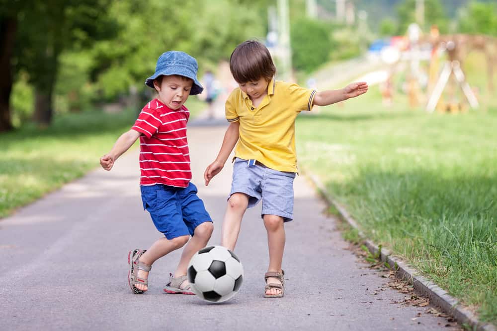 Two,Cute,Little,Kids,,Playing,Football,Together,,Summertime.,Children,Playing