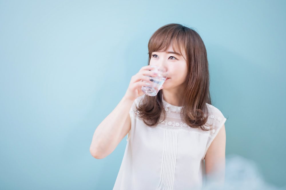 Asian,Woman,Drinking,Mineral,Water