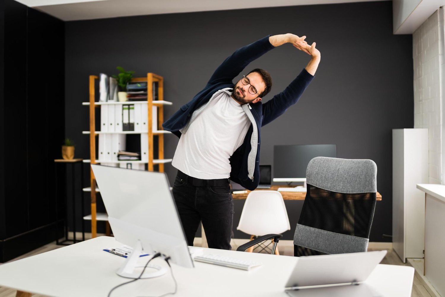 Working at a Desk All Day? These Stretching Exercises Can Help Ease Back Pain Working at a Desk All Day? These Stretching Exercises Can Help Ease Back Pain
